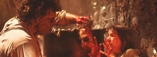 Leatherface woos Stretch the only way he knows how from TCM2