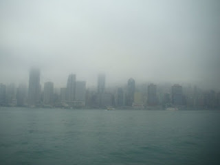 a city skyline in fog