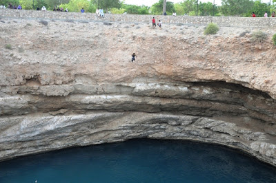 Sinkhole Oman on Notice The Fearless Man Jumping From The Mid Upper Middle  We