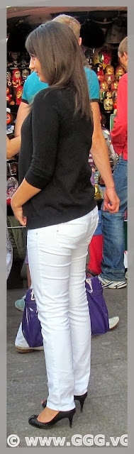 Girl in white pants on the street