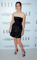 Emma Watson strikes a pose in a black dress