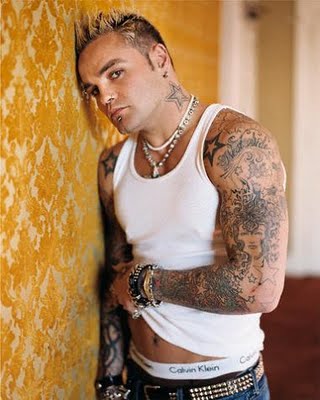 Black framed star tattoos on punk boy shoulders and neck