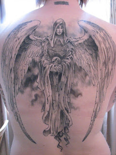 full back tattoo - Angel of Death holding a human skull