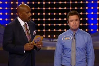 A contestant reacts to an unusual answer on Steve Harvey's Family Feud