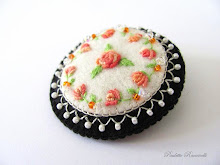 round pin with embroidered roses