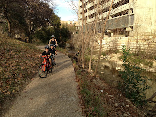 riding bikes with kids on Shoal Creek trail in Austin