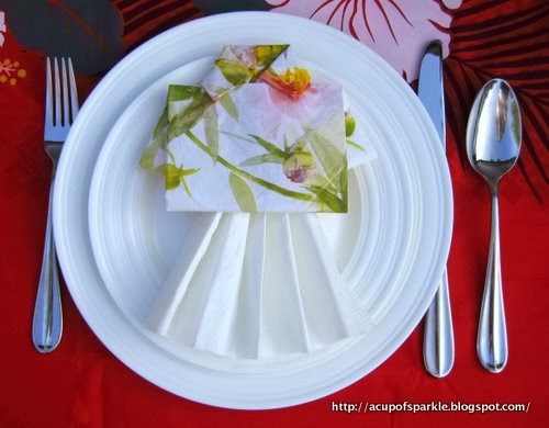 http://acupofsparkle.blogspot.com/2011/08/lets-hula-hawaii-hula-girl-napkin-fold.html