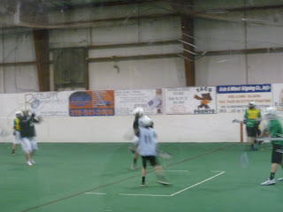 It is very hard to take pictures of indoor Lacrosse.
