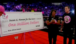 wwe gives Susan G Coleman a cheque for 1 million for breast cancer research
