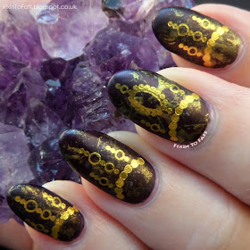 #manimonday OPI Every Month is Oktoberfest, saran/cellophane marbled with Models Own 25 Carat Gold, with gold chain water decals from Born Pretty Store nail art.
