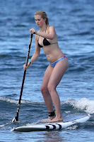 Ireland Baldwin in a bikini on a paddle board