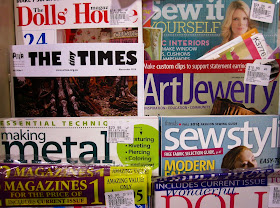 November issue of The tiny Times, displayed amongst the magazines at a newsagents.