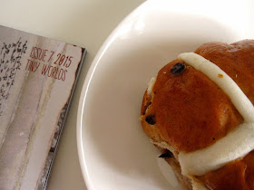 Magazine with 'Issue 7 205: Tiny worlds' written on the cover, next to a mini hot cross bun on a saucer.