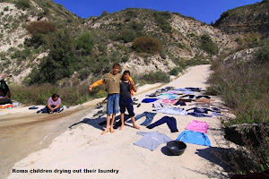 Roma children drying out their laundry