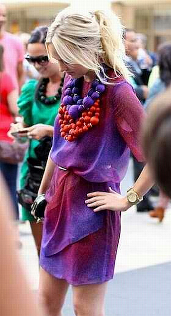 street style: purple artistic dress with bold orange necklace