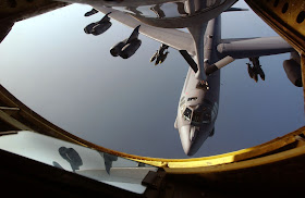 A B-52 Stratofortress receives fuel from a KC-135 Stratotanker over the Indian Ocean.