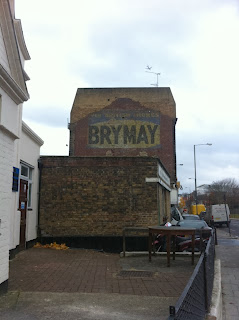 Ghost sign in Lillie Road, London SW6