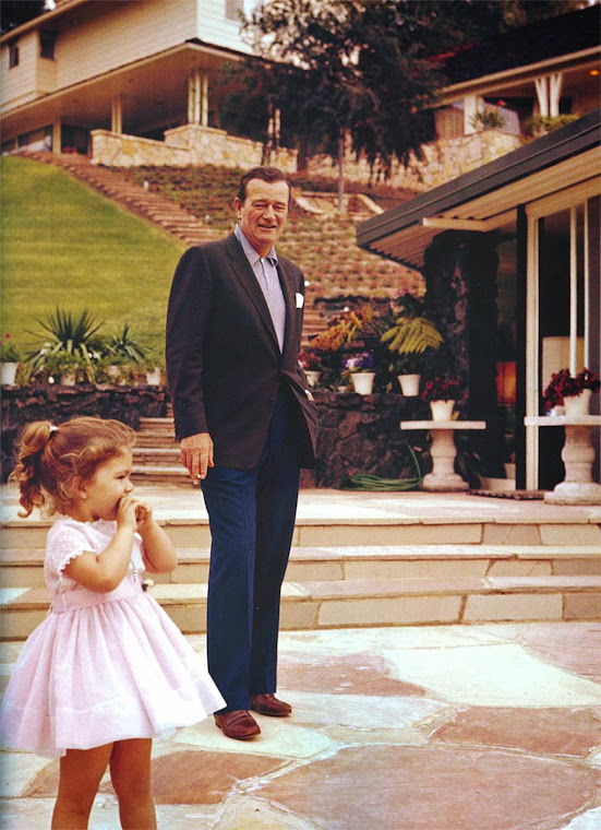 John Wayne & Aissa at the pool. 1960s.