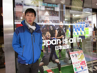 me looking blank in front of the Tokyo Adidas store