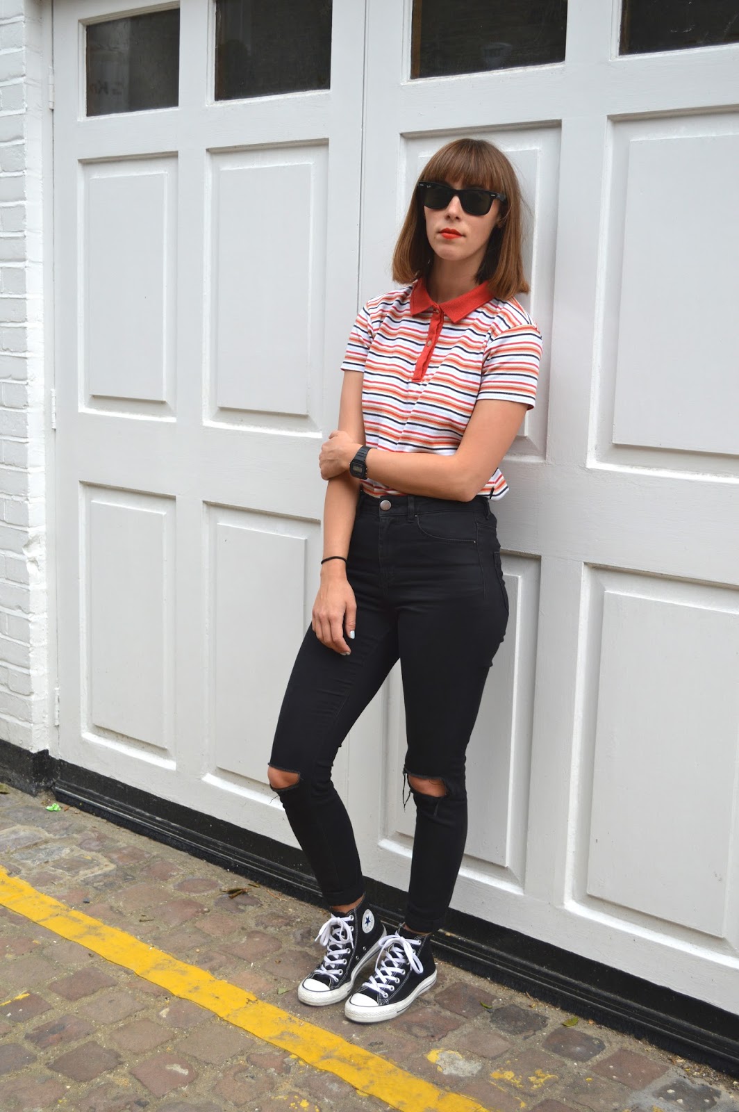 ripped jeans and polo shirt