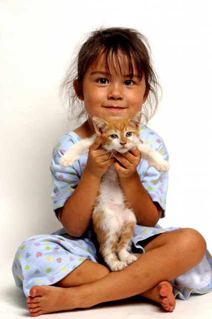  girl holding kitten 