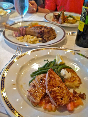 Lamb on one plate, fish on the other Lamb on one plate, fish on the other