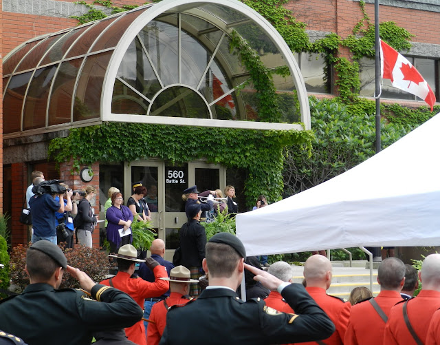 The Last Post is played while the crowd listens