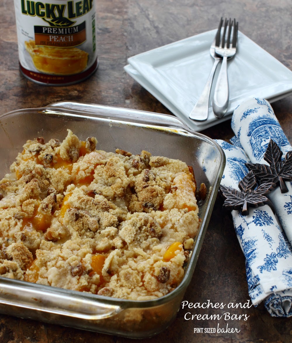 Sweet Peaches and Cream Bars made with cream cheese, peaches and a walnut crumble topping. 