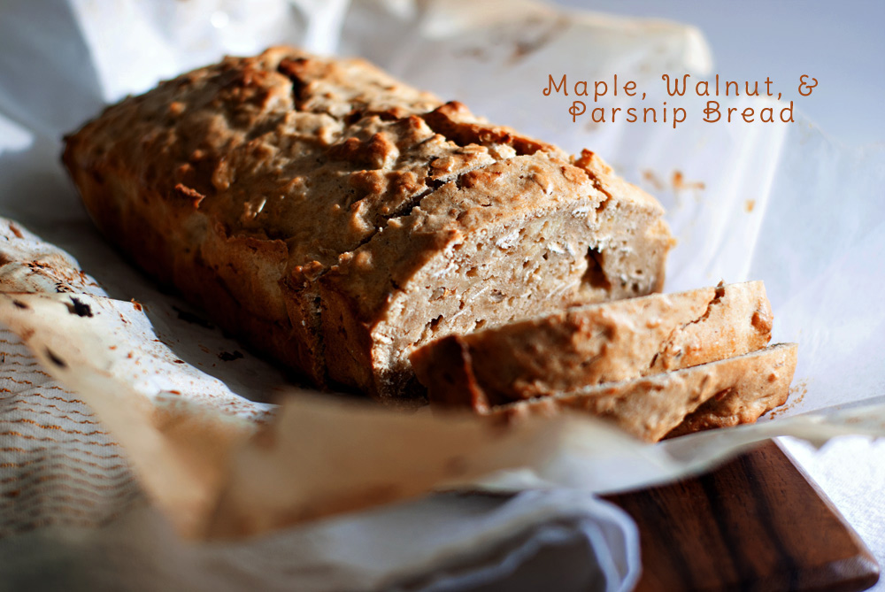 loaf of maple, walnut, and parsnip bread, sliced a photogrpah of maple, walnut, and parsnip bread, sliced