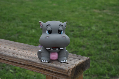 plastic rhinocerous sitting on deck