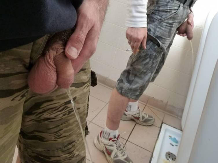 Men holding piss