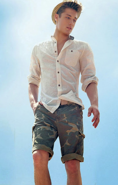 white seersucker button-up shirt, straw hat, camouflage shorts, tan belt 