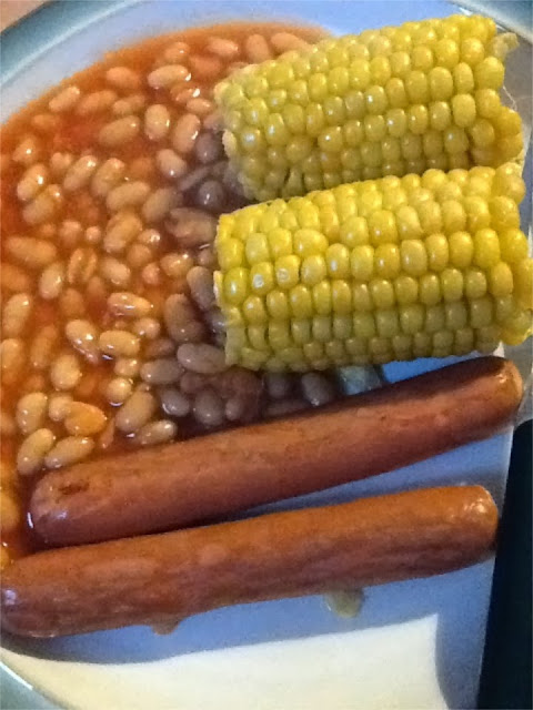 Princes hot dogs with corn on the cob and baked beans