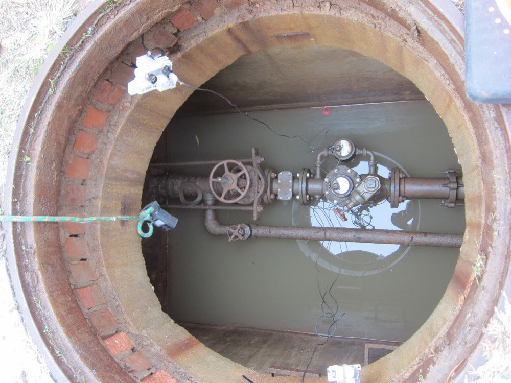 Ode Street Tribune new digital water meter underground on 12th St.