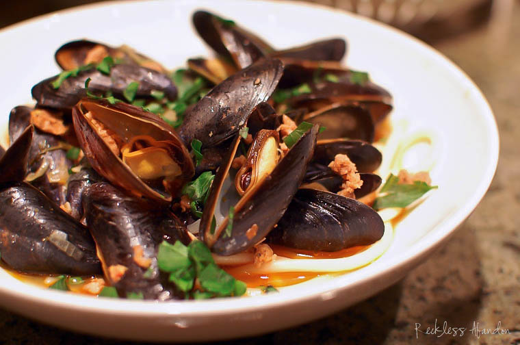 Reckless Abandon Steamed Mussels with Italian Sausage over Pasta