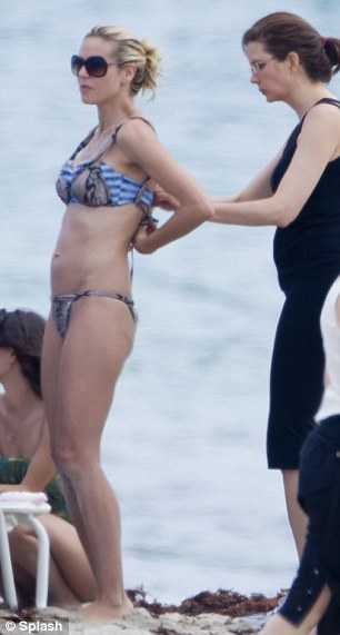 Heidi frolicked on the beach with her children - Leni, seven, Henry, five, ... Heidi frolicked on the beach with her children - Leni, seven, Henry, five, ...