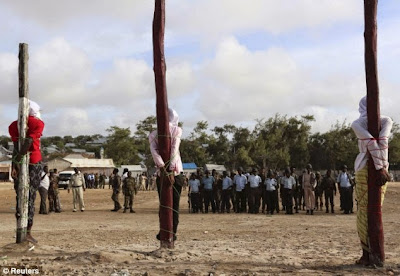 Firing squad execution of suspected militants in Somalia, August 2014.