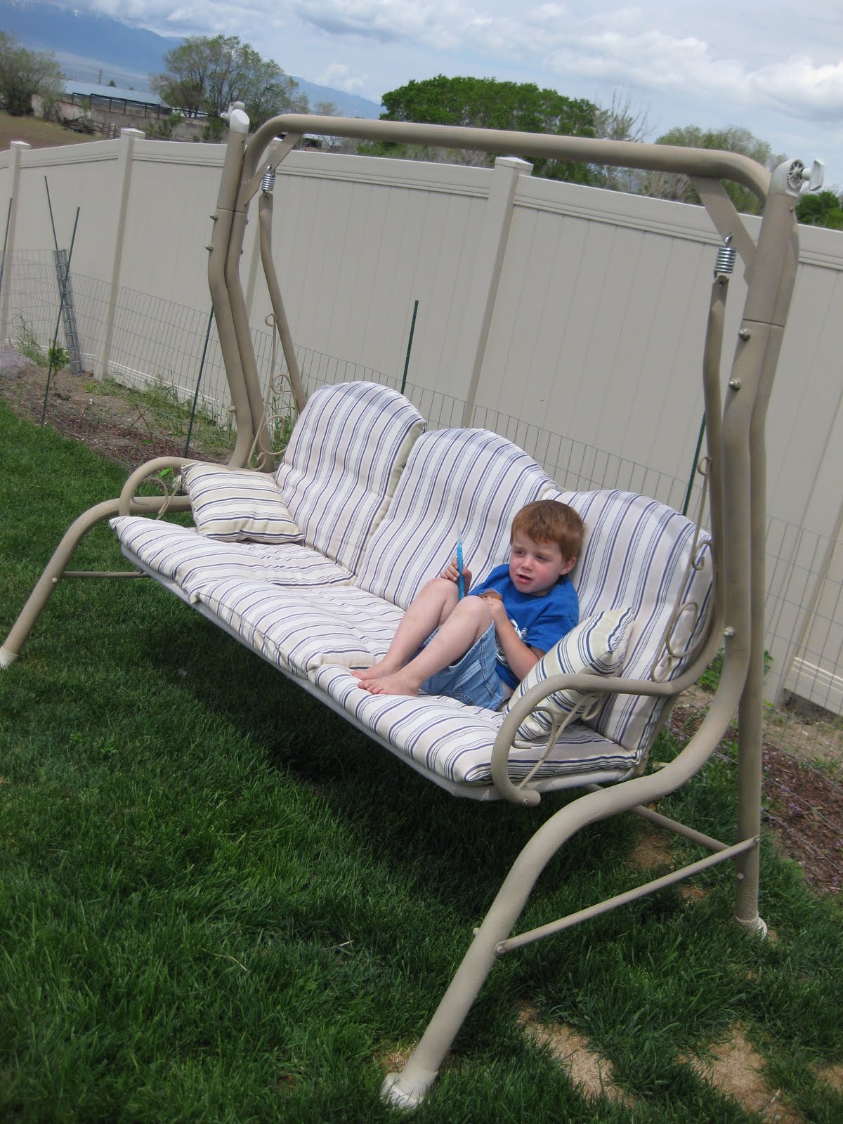 4 Growing Boys Patio Swing Redo....