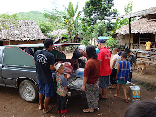 children receiving their supply deliveries