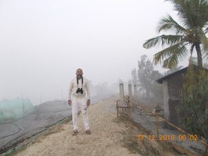 Outside  our resort on the Embankment of Pakharala village in early morning mist.