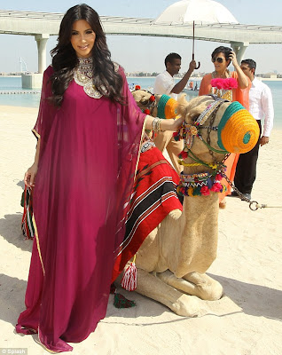 OMG..How did Kim Kardashian mount a Camel With 8 Inches Louboutins 3