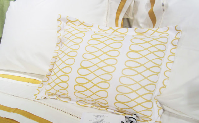 Close up of the Nbaynadamas Loop pillow in yellow on Downtown Company