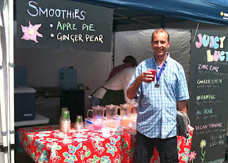 a man holding a red drink