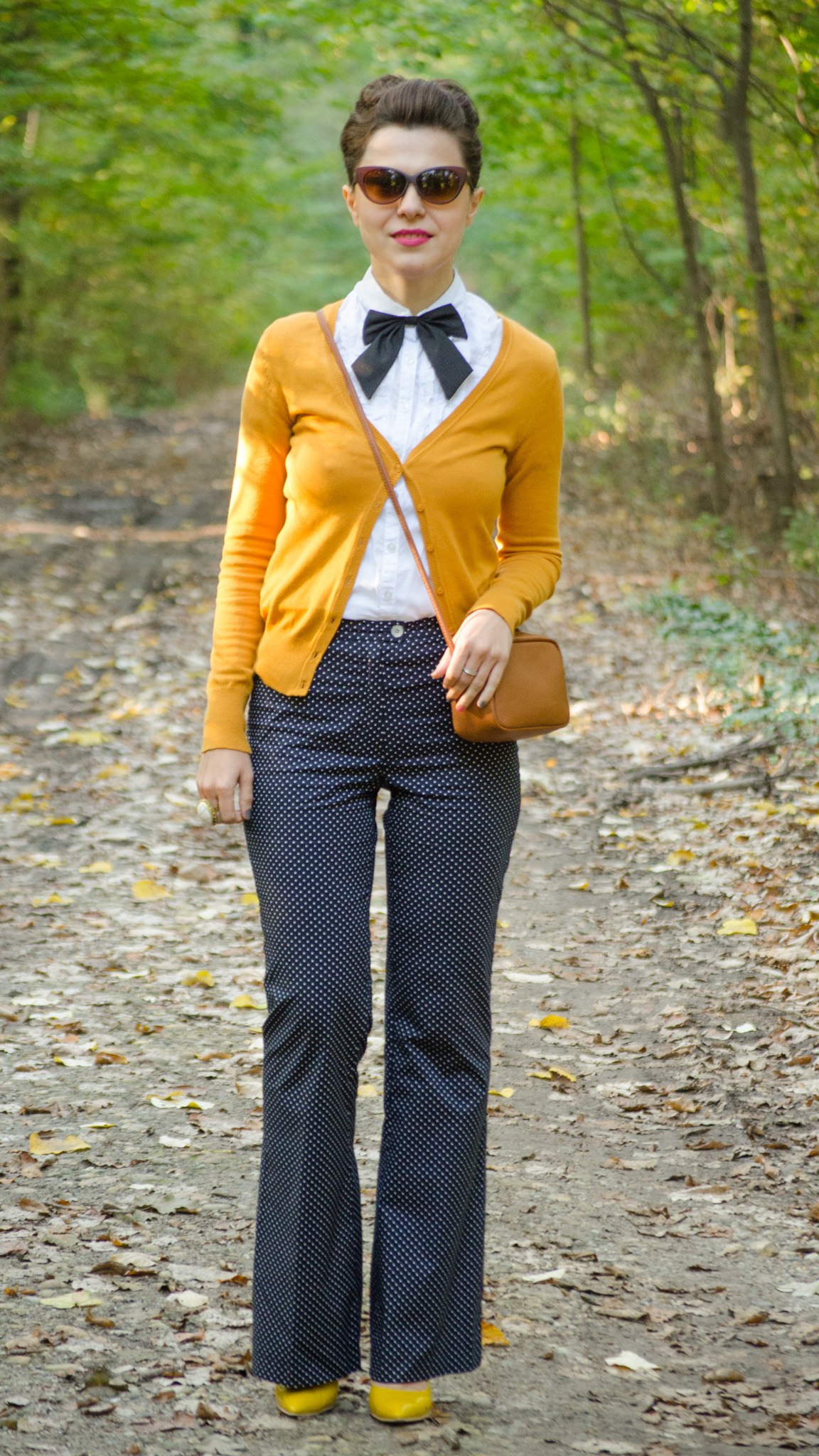 navy flares pants white shirt mustard sweater black bow-tie brown satchel bag koton C&A dotted cat-eye glasses mustard heels