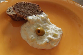 Tzatziki with a slice of Greek olive bread