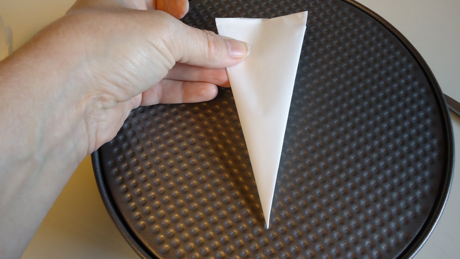 Unique Party Food to Go Cutting parchment paper to fit a round pan