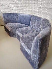 Modern miniature three piece grey velvet booth seating.