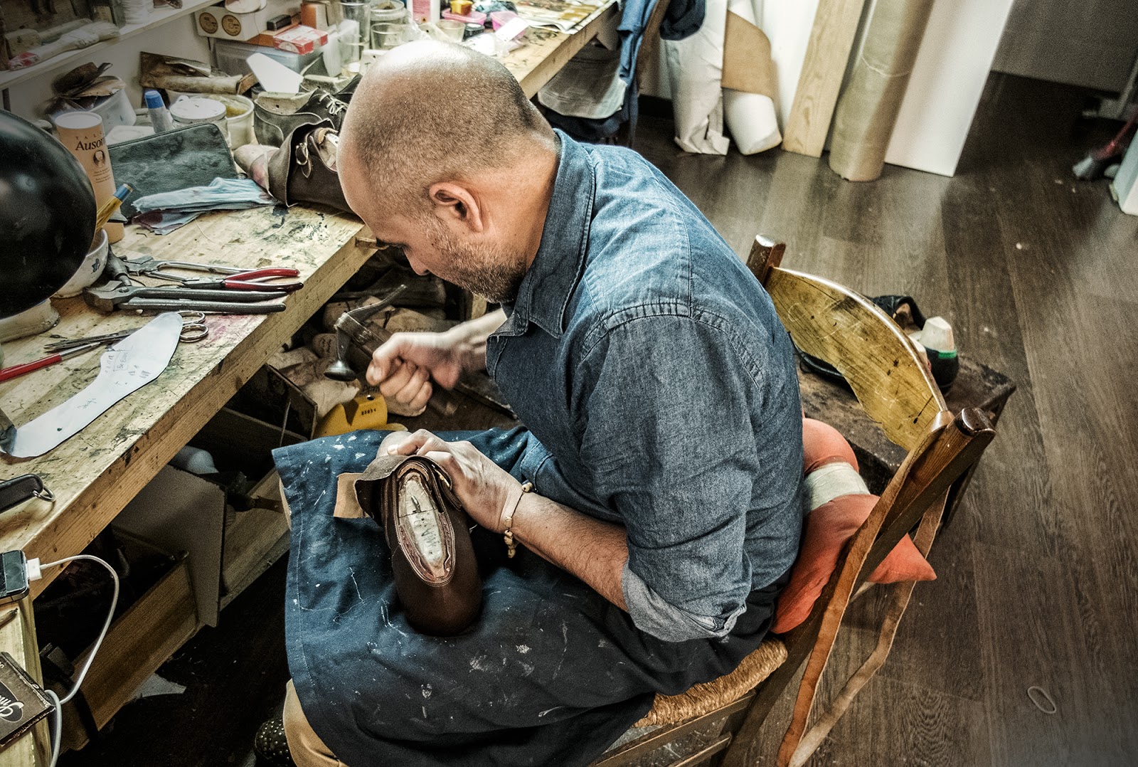 Norman Vilalta working on shoes