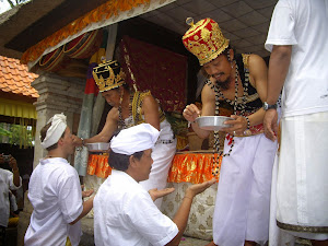 PRIESTS DISPENSE BALI'S FAVORITE DRINK, BLESSED HOLY WATER