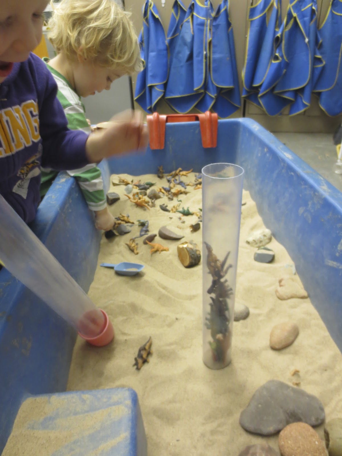 SAND AND WATER TABLES ROCKS, STICKS, LITTLE DINOSAURS, AND CLEAR